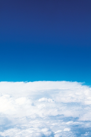 Cumulous clouds with deep blue sky の写真素材