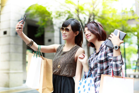 Two young women shopping togetherの写真素材