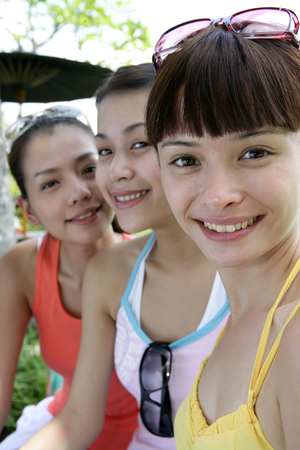 Three young women laughingの写真素材
