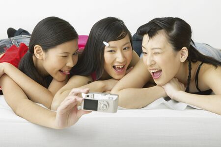 Young women taking photos of themselvesの写真素材