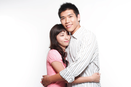 Portrait of a young couple embracingの写真素材