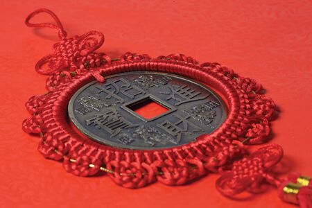 Chinese knot with Chinese coin in it の写真素材