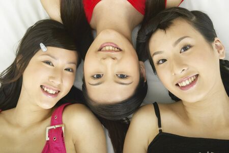 Close up of young women lyingの写真素材