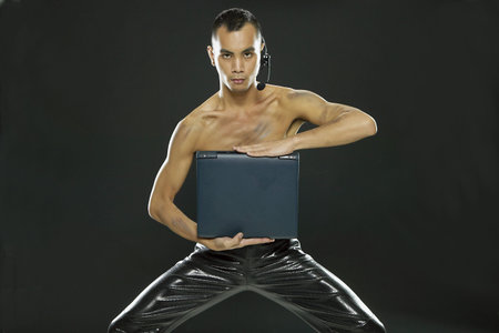 Young woman holding a notebook computer
