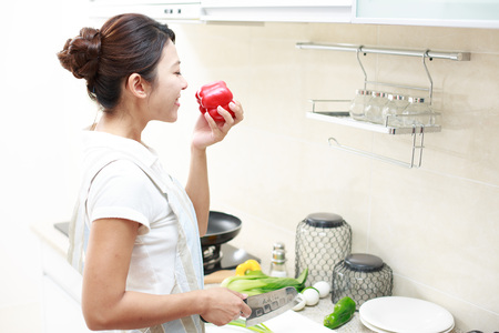 Asian young woman is cookingのeditorial素材