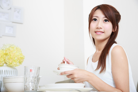 Asian Young woman with tablewareのeditorial素材
