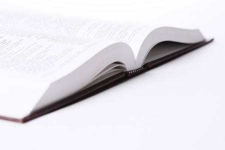 View of an open book on white bacgkroundの写真素材