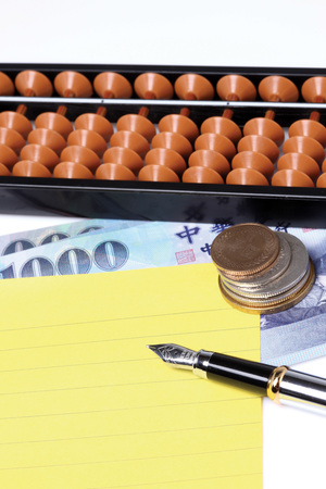 Bank notes and pen on white backgroundのeditorial素材