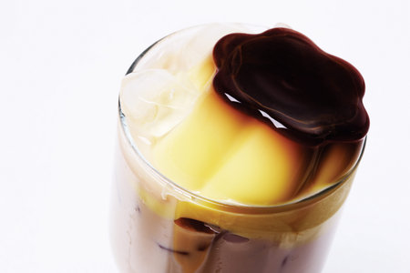 Close up to a glass of drink with pudding top