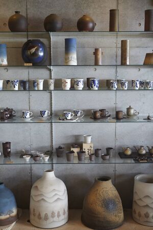 View of a rack full of cups and vasesのeditorial素材