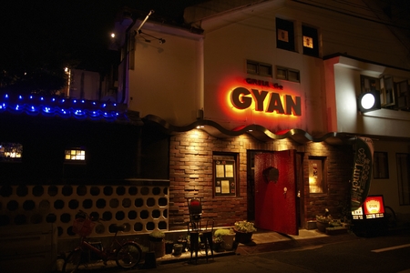 Exterior landscape view of a restaurant at nightのeditorial素材