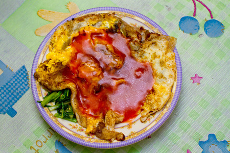 spicy fried egg with vegetableの写真素材