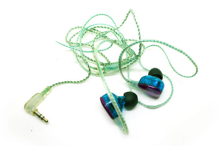 Earphone blue earbuds isolated on white background. photo