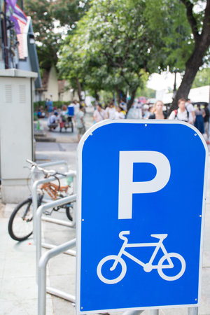 Bicycle parking near the road.の写真素材