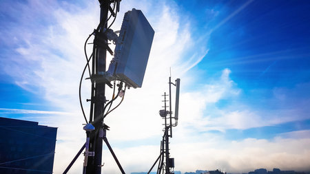 Silhouette of 5G smart cellular network antenna base station on the telecommunication mast