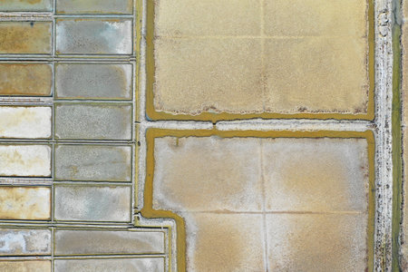 Aerial birds view from the sky of a salt pans fields structure and architecture pattern in Slovenia,...