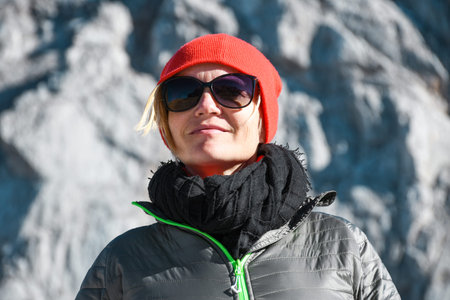 Portrait of a woman with grey jacket and sunglasses on a nice sunny autumn day on a trip in Julian...