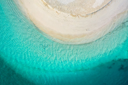 Aerial top down view with drone of an tropical exotic island paradise with turquoise crystal clear...