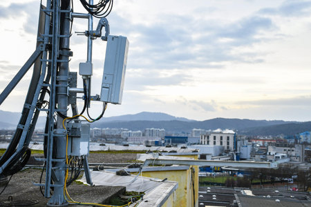 5G new radio telecommunication network antenna mounted on a metal pole providing strong signal waves...