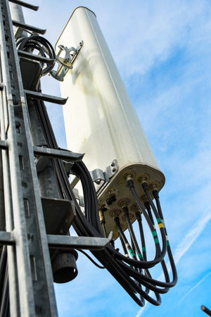 Cellular radio telecommunication network antenna mounted on a metal pole providing strong signal...