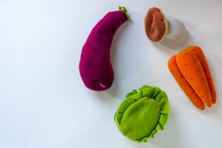 children's toy vegetables on white background. food delivery concept.