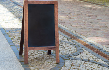 Empty menu board standing on the streetの写真素材
