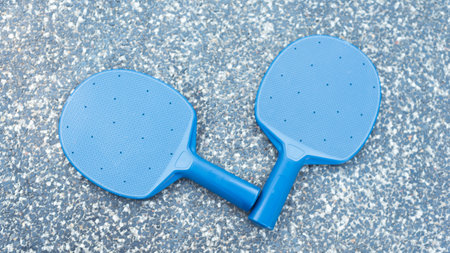 Pair of table tennis paddle and ballin the granite backgroundの写真素材
