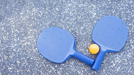 Pair of table tennis paddle and ballin the granite backgroundの写真素材