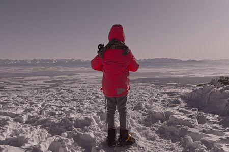 girl on top, admires the Tatra Mountains panoramaの写真素材