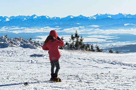 girl on top, admires the Tatra Mountains panorama