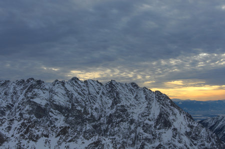 Sunset observed from the top of the mountain. View of the peaks.