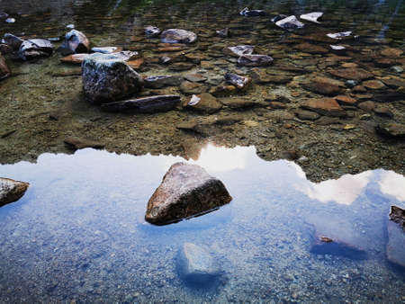 Reflection of mountain peaks in the pond.の写真素材