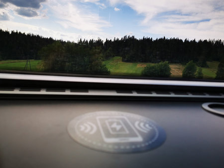 Symbol of wireless charging placed on the table in the train. Wireless charging.
