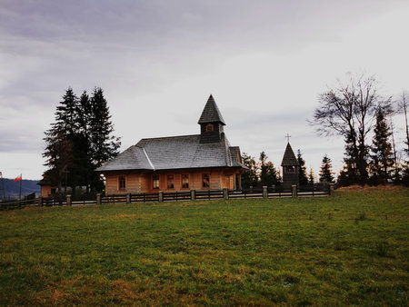 The wooden church on a background of the cloudy sky.