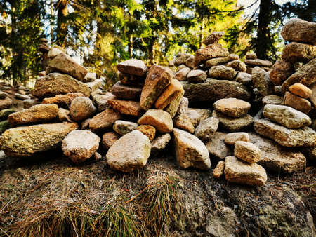 Stone mounds set up by the mountain trail.の写真素材