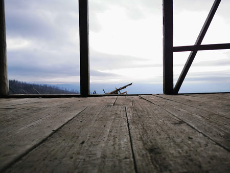 View of the cloudy sky from the wooden shepherd's house. Cottage in the mountains view through the...