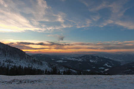 Sunset in the mountains. Winter in the mountains at sunset. Silesian Beskids.の写真素材