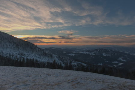 Sunset in the mountains. Colorful sky during the sunset. Winter Beskid Å»ywiecki.の写真素材