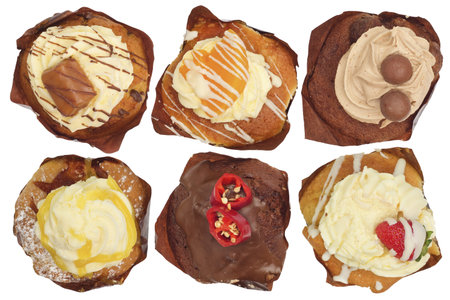 Cupcakes of different flavours against white shot from aboveの写真素材