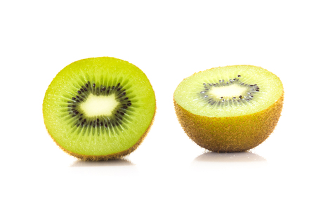 Kiwi fruit is cut fresh fruit inside and reflections on the floor.の写真素材