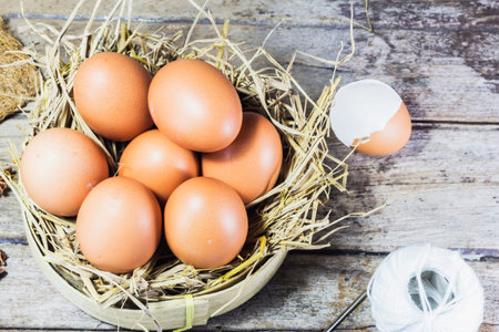 Farm fresh egg on a wooden table.の写真素材