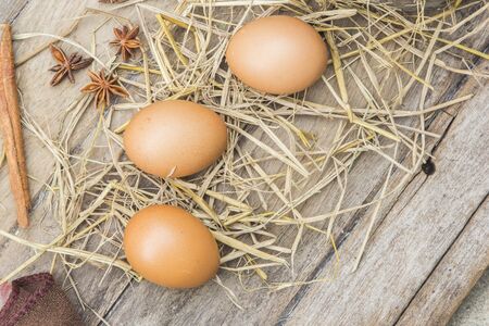 Farm fresh egg on a wooden table.の写真素材