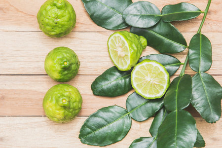 Kaffir lime herbs fresh from the farm on the wooden floor.