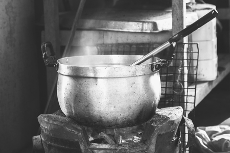 Black and white cooking in a pot on the stove.の写真素材