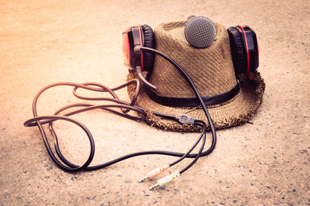 Vintage style microphone, headphones, hats.の写真素材