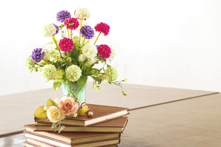 Old book with flowers in the library to study.の写真素材