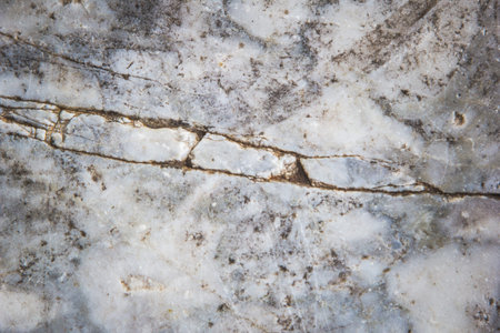 Stone abstract background with a pattern caused by water erosionの写真素材