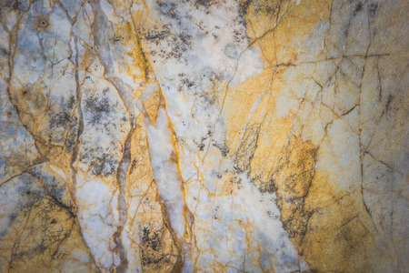 Stone abstract background with a pattern caused by water erosionの写真素材