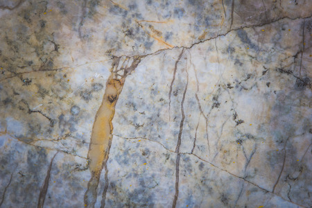 Stone abstract background with a pattern caused by water erosionの写真素材