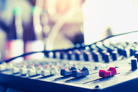 Mixer level control knob in the control room and sound recorder.